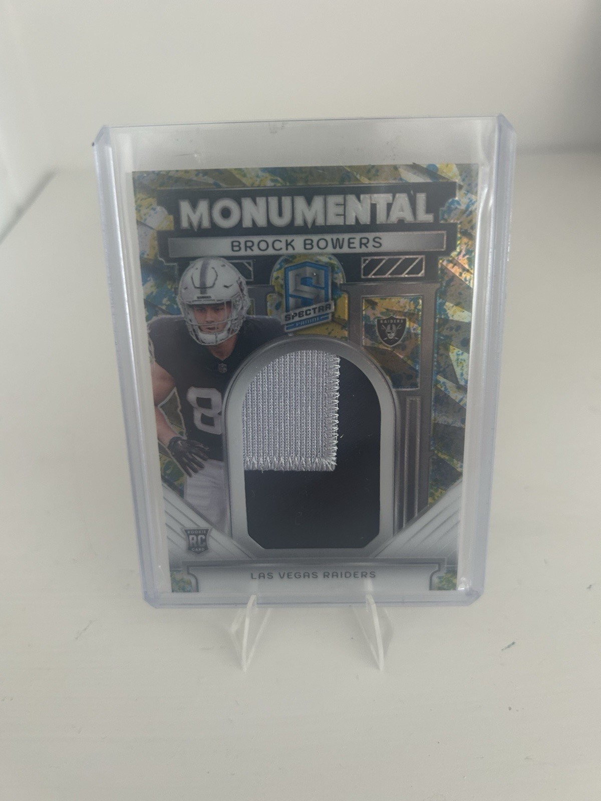 2024 Panini Spectra - Monumental Brock Bowers Splatter Neon /8