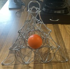 modern chrome-plated wire fruit basket or display rack, sculptural orange holder