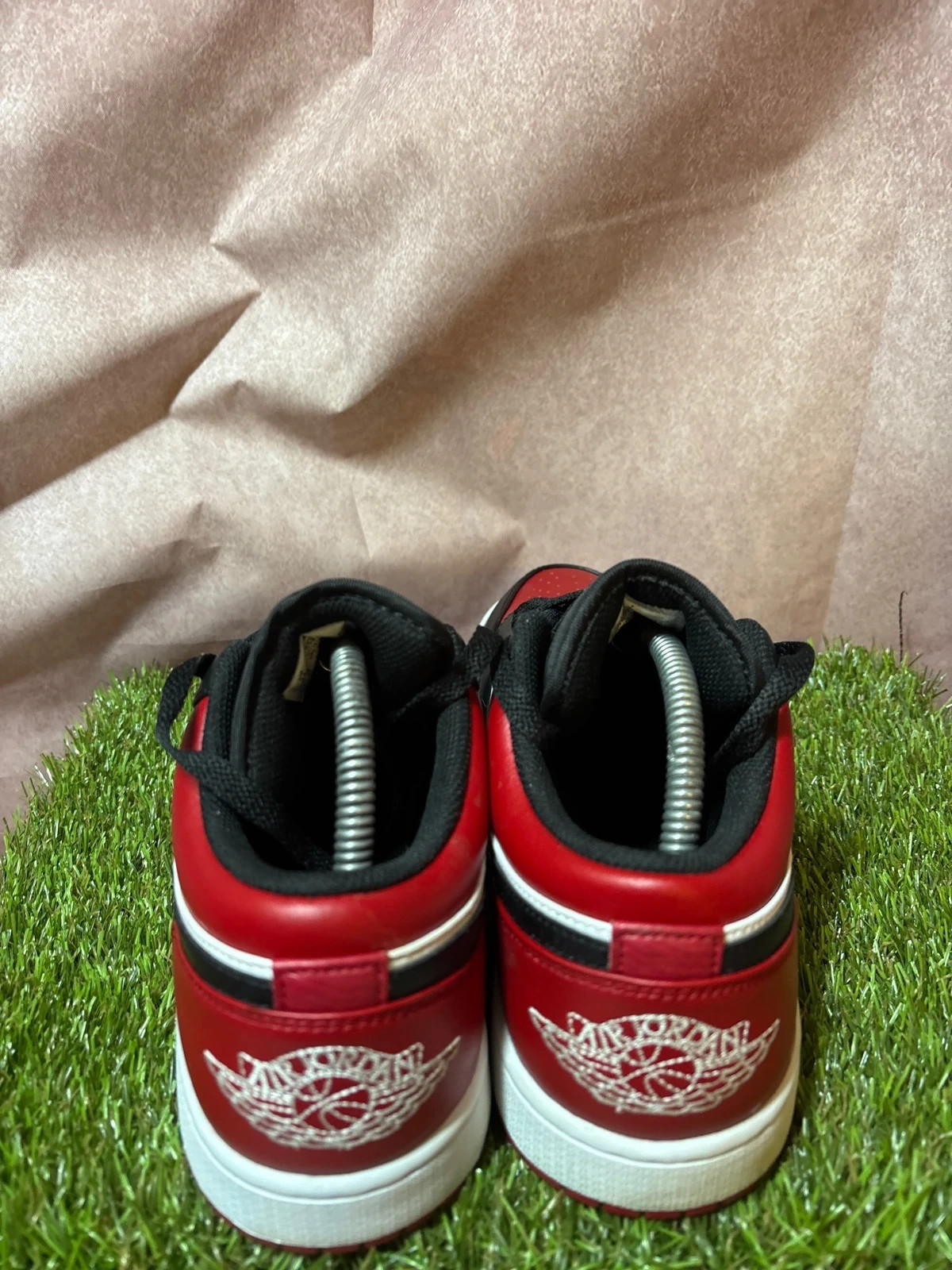 Nike Air Jordan 1 Low Bred Toe Mens Trainers in a black, red, and white image 4
