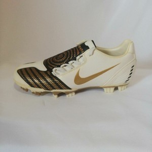 nike gold and white soccer cleats