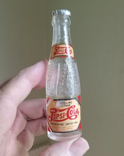 VINTAGE MINIATURE 4 1/4"TALL PEPSI:COLA EMB & LABELED SODA BOTTLE WITH CAP