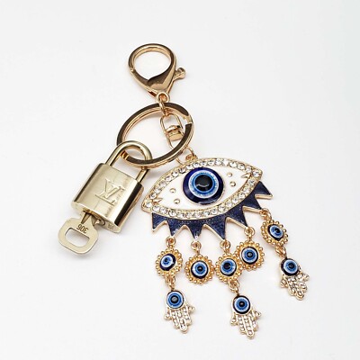 Louis Vuitton Gold Lock   Authentic LV Key + Unbranded Evil Eye Bag Charm