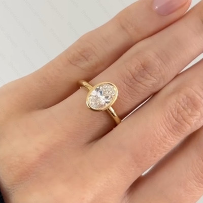 1.96Ct 9X7mm Oval Cut Moissanite Bezel Engagement Ring In 14k Yellow Gold Plated