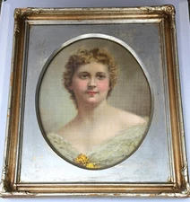 ANTIQUE OVAL GLASS FRAMED CHROMOLITHOGRAPH PROTRAIT OF A YOUNG WOMAN 11" X 13"
