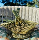 Vintage McCoy green basket planter with handles. Measures 6 inches tall by 8.5