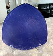 Annie Glass triangular shape plate. Purple/Blue in color. Signed and dated 94-95