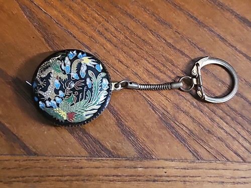 Rare antique Oriental tape measure and key chain, Strong Spring, Low Use. 1.5"