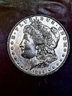 KEY 1894-P MORGAN DOLLAR, lightly circulated. Just a hunt of wear! Nicely toned.