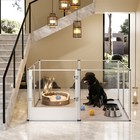 Black dog in 52-inch clear acrylic playpen with cushioned floor, toys, and metal bowls inside a modern indoor space.