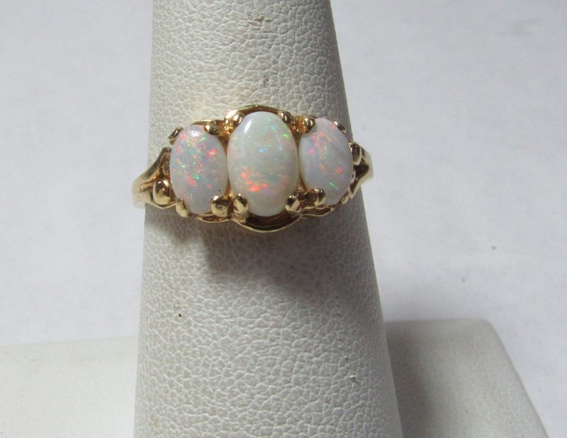 SOLID 14K GOLD RING W/ THREE OVAL NATURAL OPALS