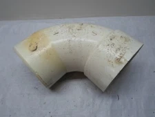 Unused, Dirty, PVC Pipe 6 in. PVC DWV 90-Degree SPG x Hub Charlotte Pipe
