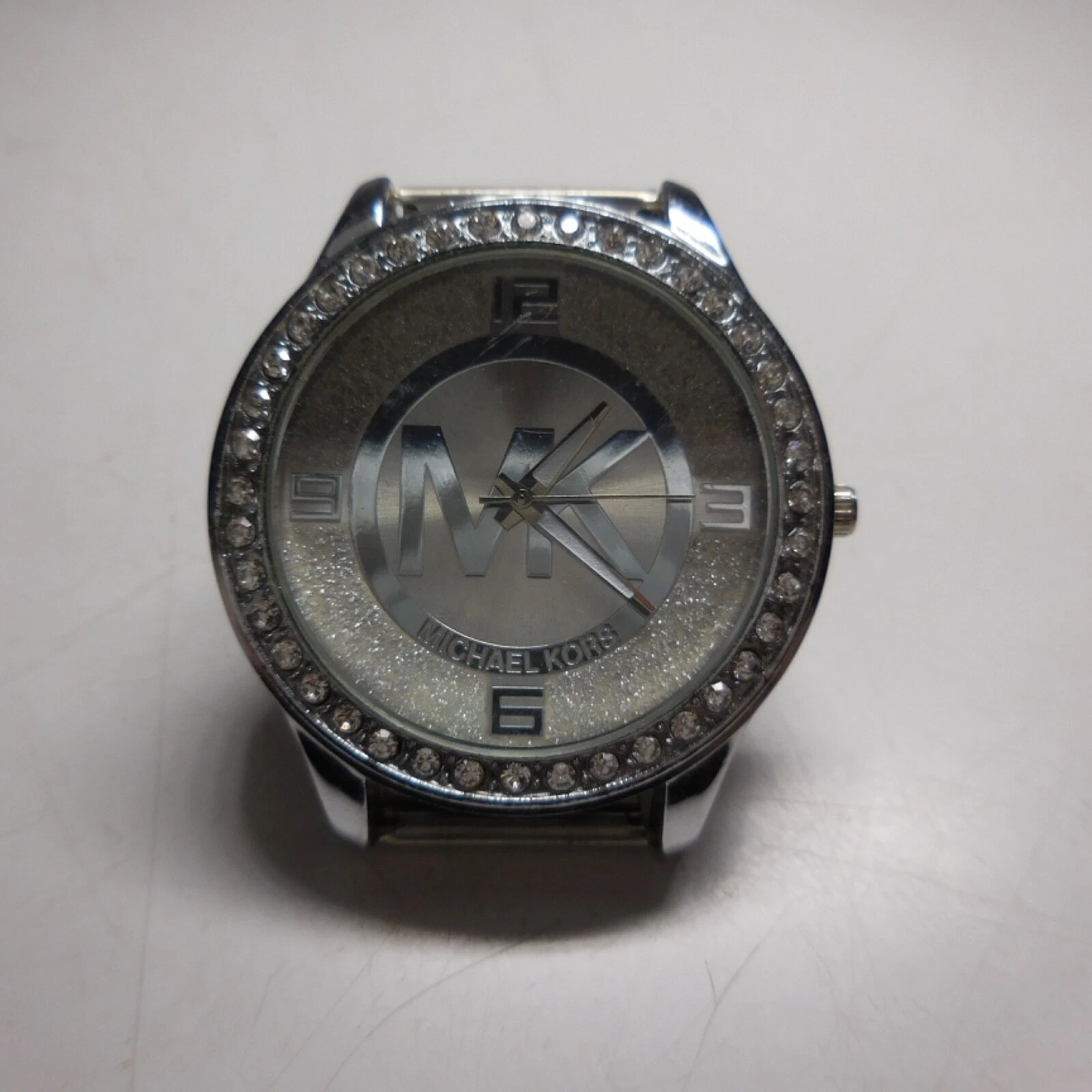 N24.382 MK Michael Kors montre bracelet aiguilles métal gris argent diamants