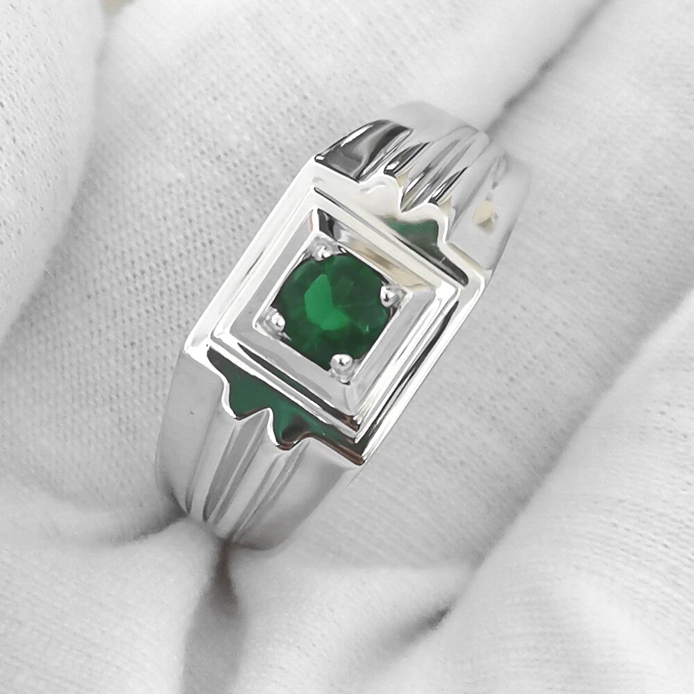 Emerald green stone ring lined with heavy cz -