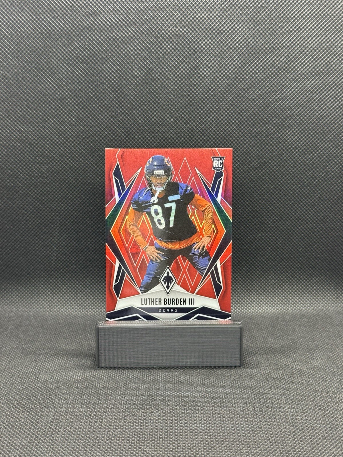 2025 Panini Phoenix Luther Burden III Red Phoenix /99 #196 (RC) Chicago Bears