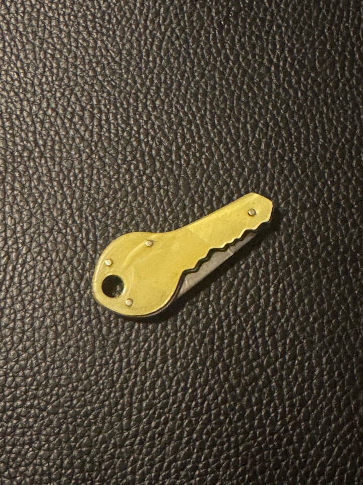 A folding pocket knife shaped like a skeleton key — clever disguise meets everyday carry novelty.