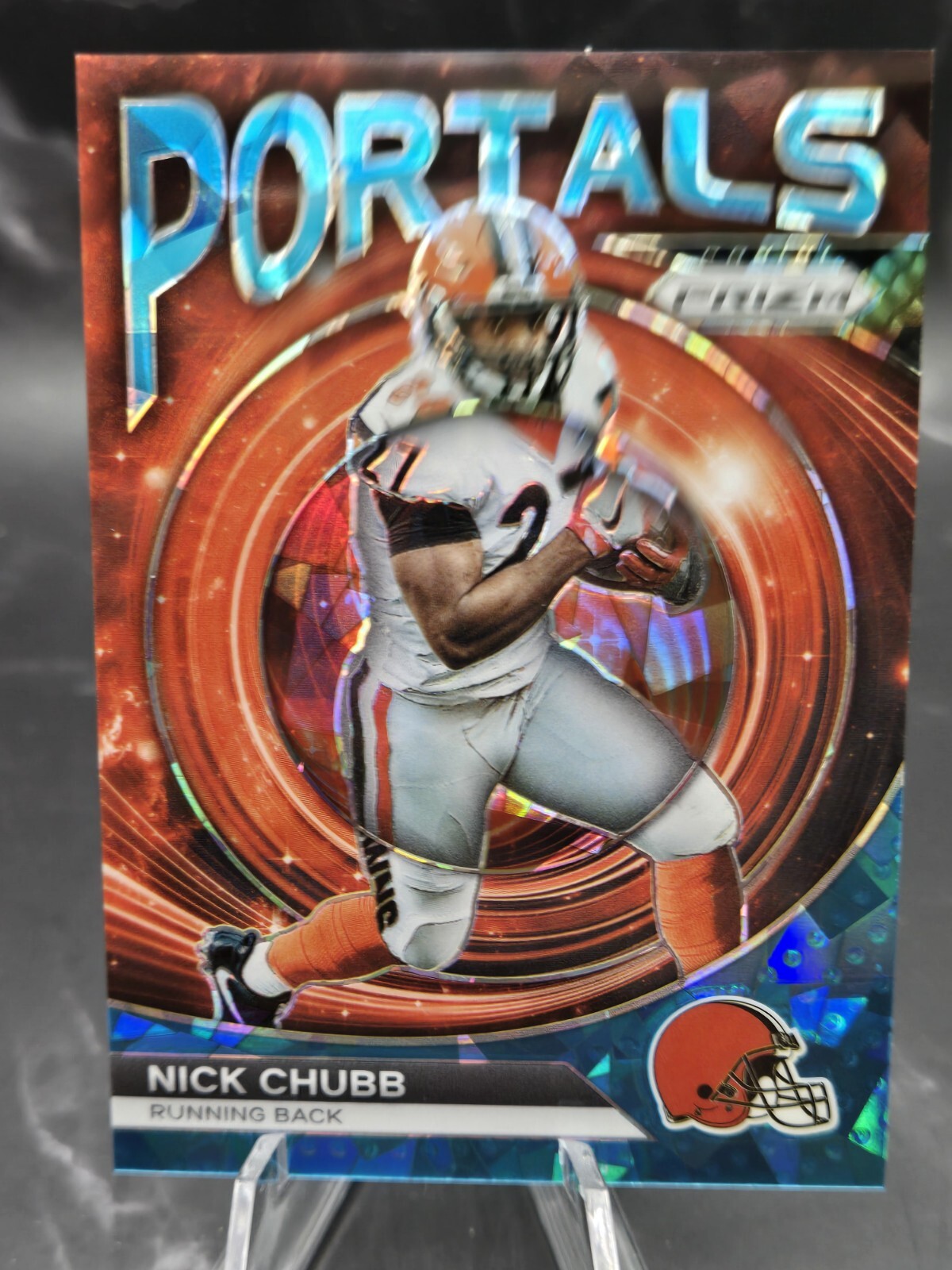2023 Panini Prizm Portals Prizms Blue Ice #9 Nick Chubb /99
