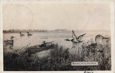 Exaggeration Real Photo Postcard Hunter in Boat Shooting Giant Ducks