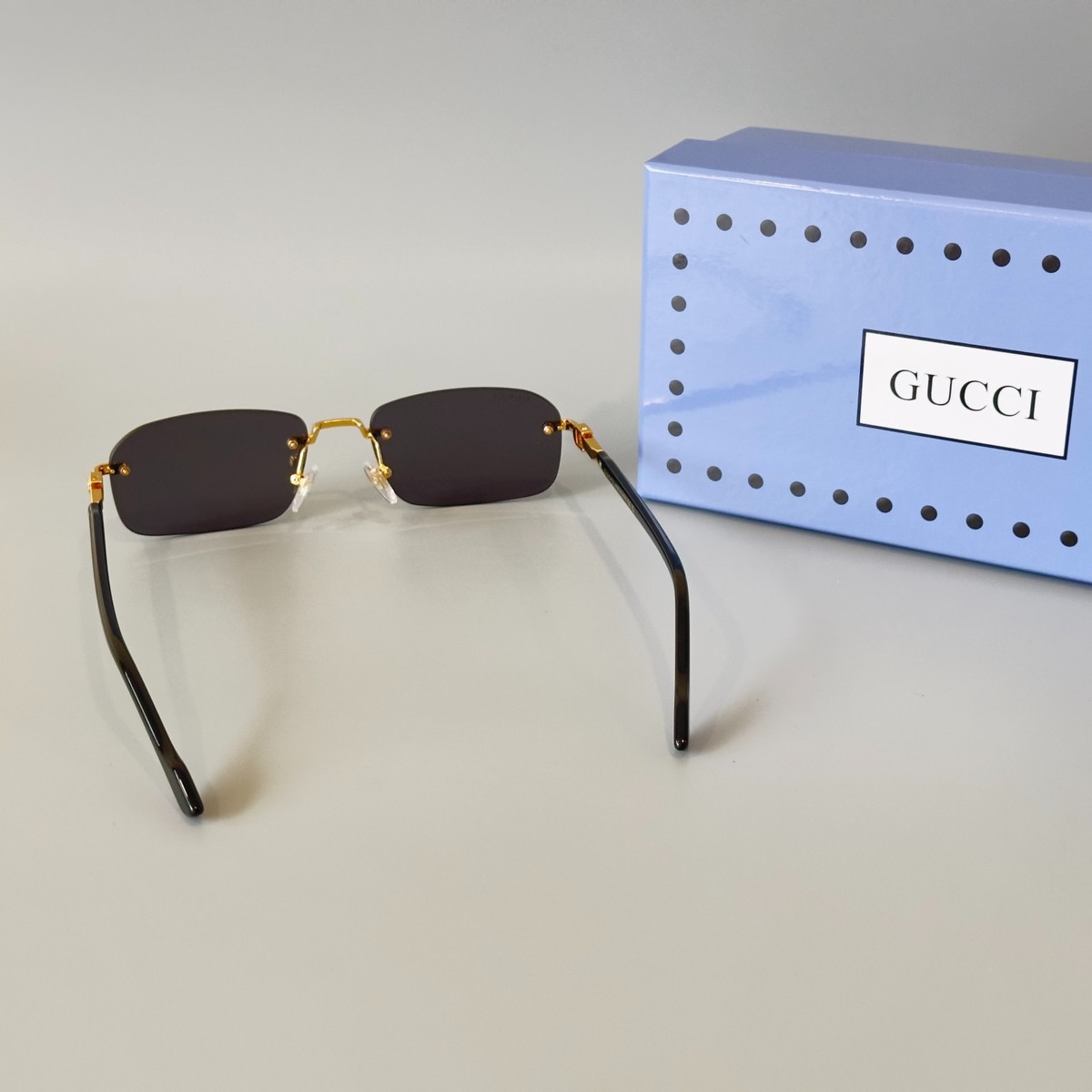 Gucci GG1221S 001 Black Gold Rimless Sunglasses Gray Lens 56mm | eBay