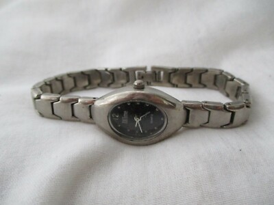 NXTime Watch Silver Toned Black Oval Shaped Face Modern Stylish WORKING!