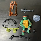 Vintage 1980s TMNT Michaelangelo Figure and Random Accessories