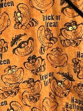 Disney Scrub Top Cheshire Cat Halloween Orange V Neck XS Front Pockets