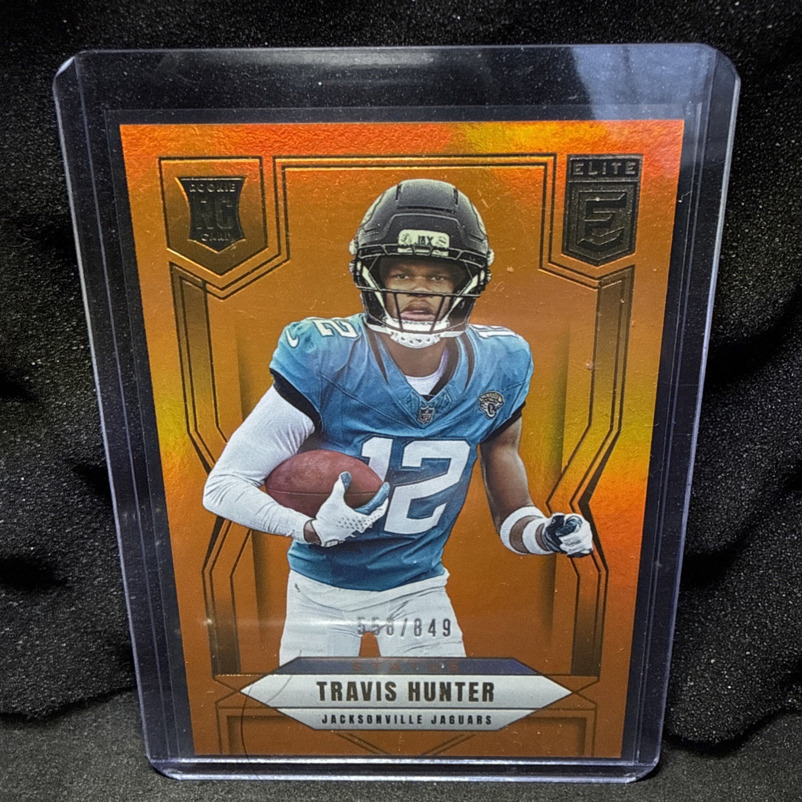 2025 Donruss Elite - Rookies Travis Hunter #114 Status Metallic Orange /849 (RC)