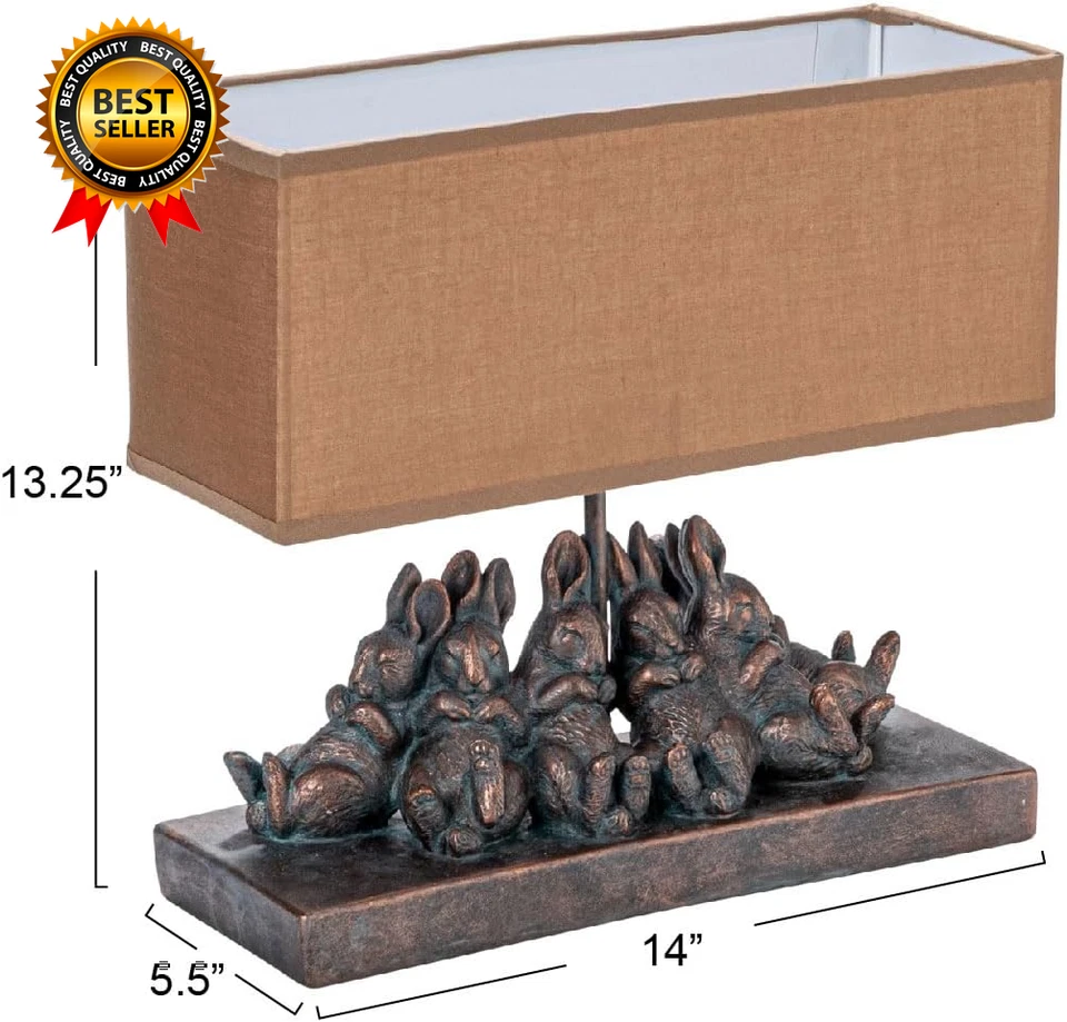 Lámpara de mesa de conejo de resina con pantalla rectangular de lino, acabado bronce Foto 3 de 4