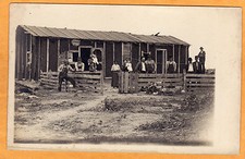 Real Photo Postcard RPPC - People and Babies Large Tar Paper House Black Woman?