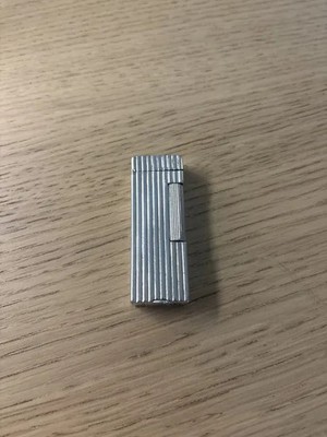 Vintage Dunhill Rollalite benzine lighter, dent on the back