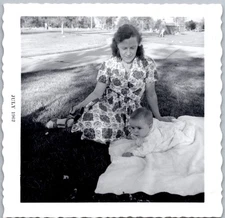 Vintage Snapshot Woman Sitting With Baby 1950s