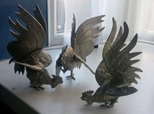 3 Metal Fighting Cockerels Smaller One Has Damage On Foot.