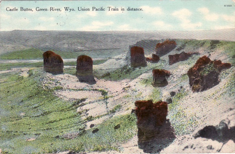 CASTLE BUTTES, GREEN RIVER, WYO. UNION PACIFIC TRAIN IN DISTANCE - OLD POSTCARD
