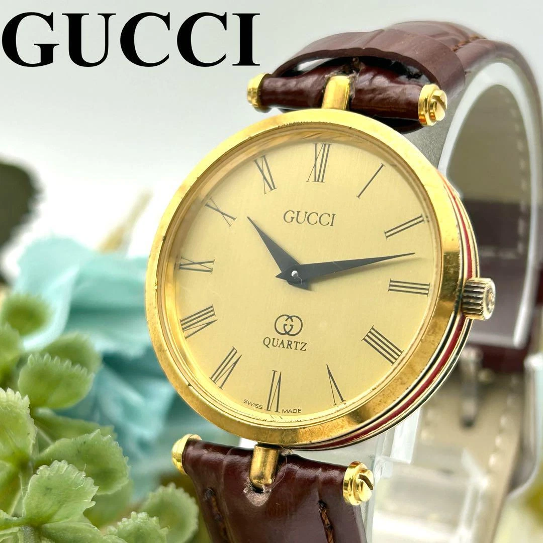 Montre femme Gucci Sherry Line ceinture cuir or