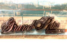 NOS GM 20275245 PONTIAC GRAND PRIX 1978-1987 TRUNK SCRIPT EMBELEM