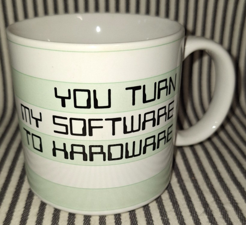 A 1984 Taylor & NG mug riffing on software/hardware jargon — vintage nerd humor on actual vintage ceramic.