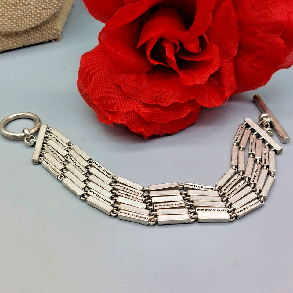 Pulsera firmada Kenneth Cole NY tono plata liso rectilíneo 8" cierre de palanca Foto 2 de 4