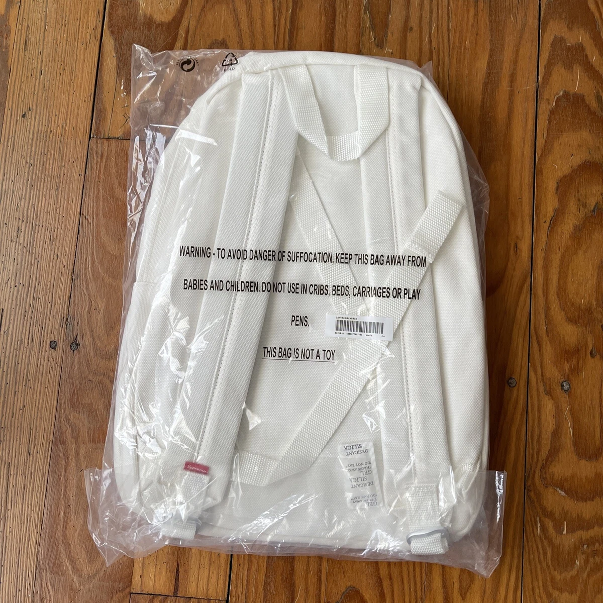 Supreme canvas cheap backpack white