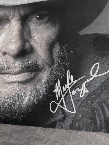 Merle Haggard Autographed In Silver.  11”x17”