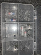 Locator Overdenture Abutment And Zest Retention Caps. Metal Cap With Black Cap