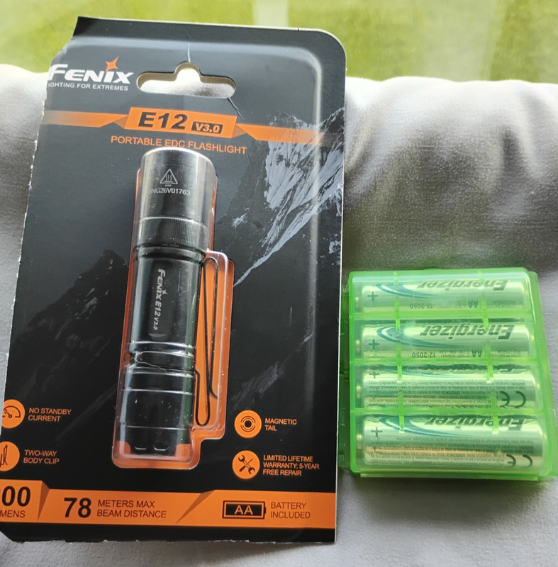 Fenix E12 V3.0. 1xAA Flashlight. Used. Includes Four New AA Batteries with Case.