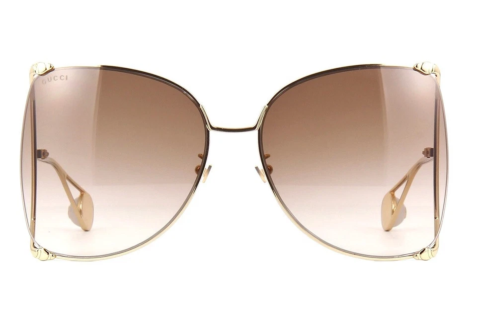 Gafas de sol Gucci GG0252S 003 para mujer doradas marrones lentes mariposa Foto 2 de 4