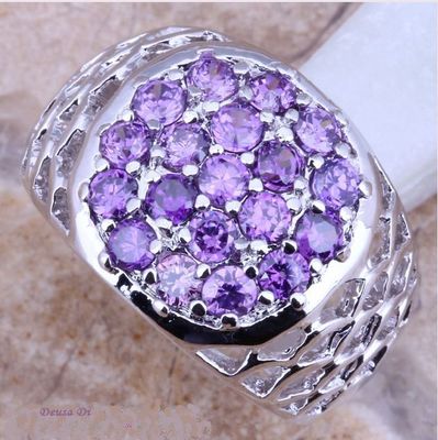 ANILLO BELLO DE PLATA DE LEY MARCADA EN LA PIEZA Y PRECIOSAS  PIEDRAS AMATISTAS 