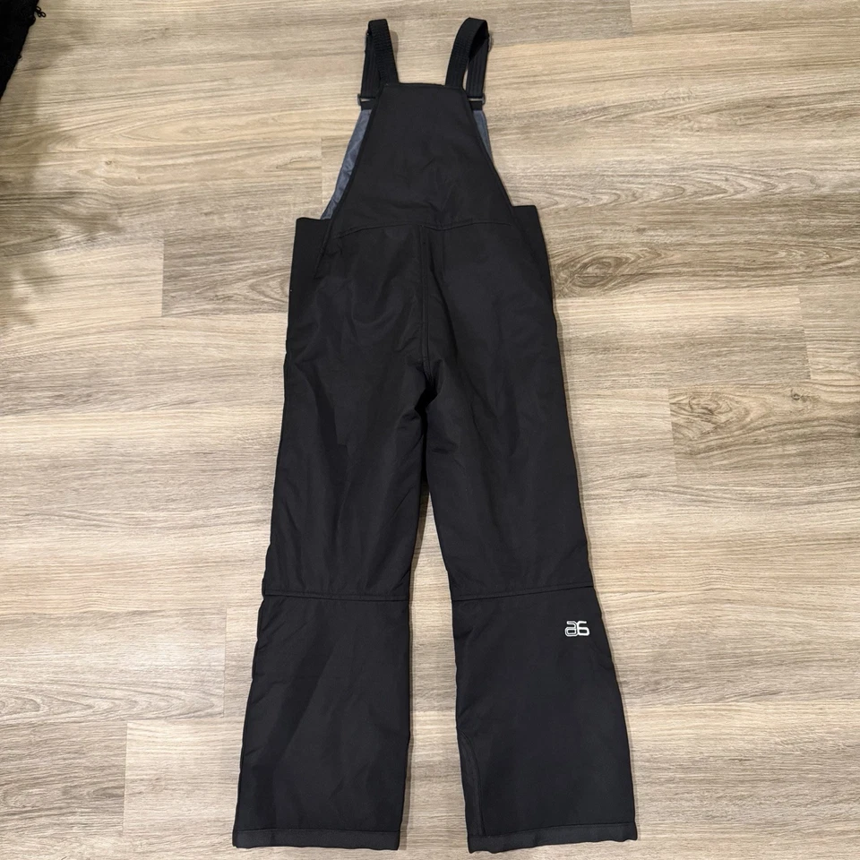 Pantalones con tirantes Arctix Youth negros aislados para esquí nieve talla mediana unisex Foto 4 de 4