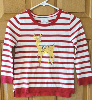 red sweater with gold sequin reindeer