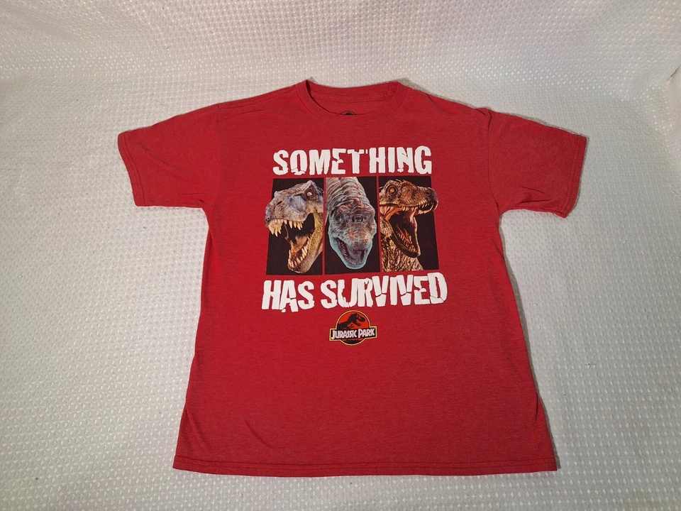 Camiseta Jurassic Park Something Has Survived roja mezcla de algodón niños talla 2XL 18 Foto 2 de 4
