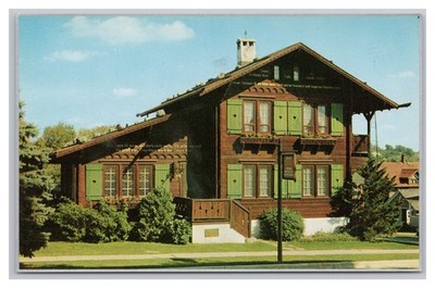 New Glarus WI Swiss Alps Chalet-Style Golden Fleece Home Vintage Postcard UNP
