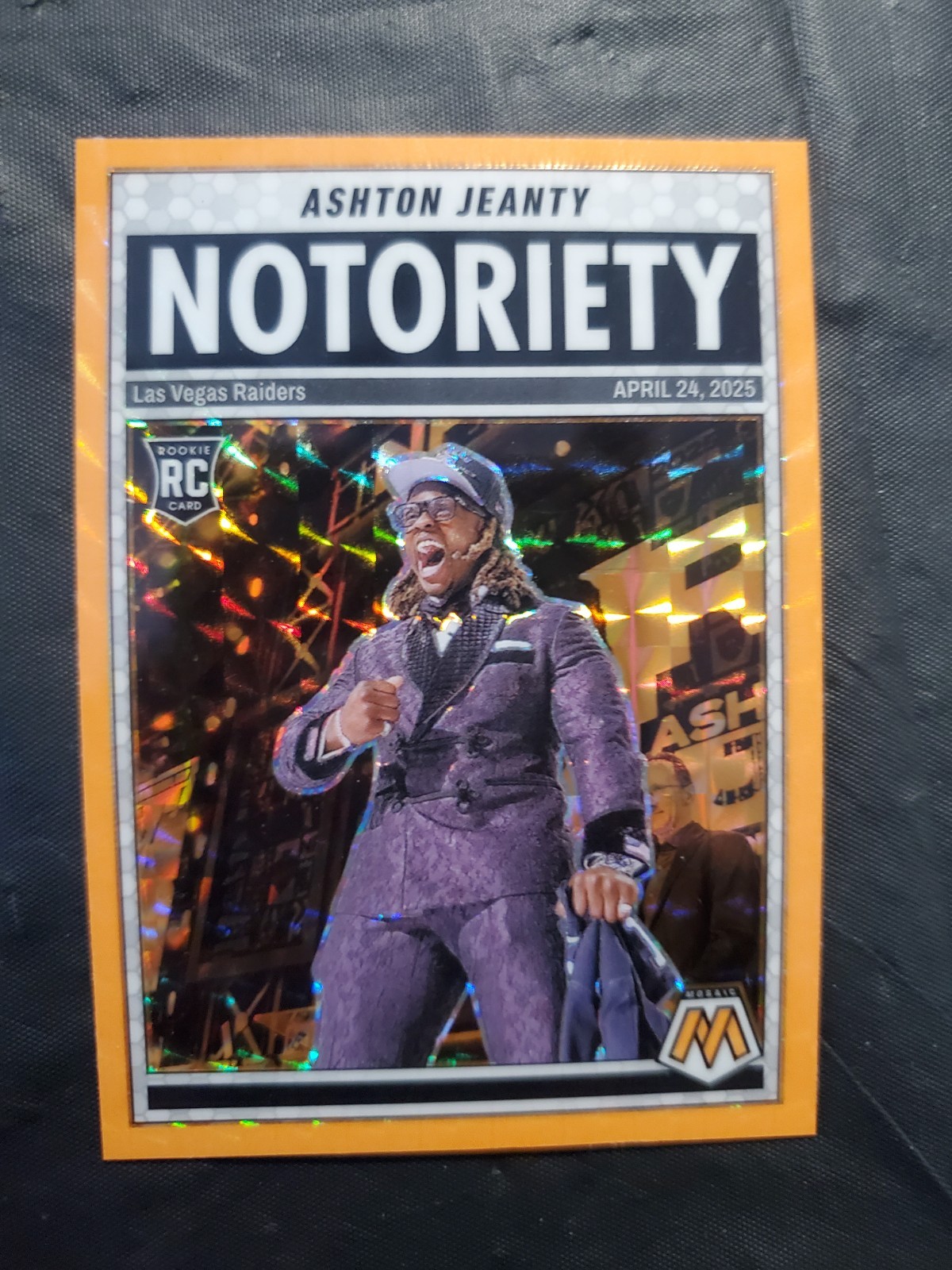 2025 Mosaic Ashton Jeanty Notoriety Orange Fluorescent Prizm #18 (RC) Raiders
