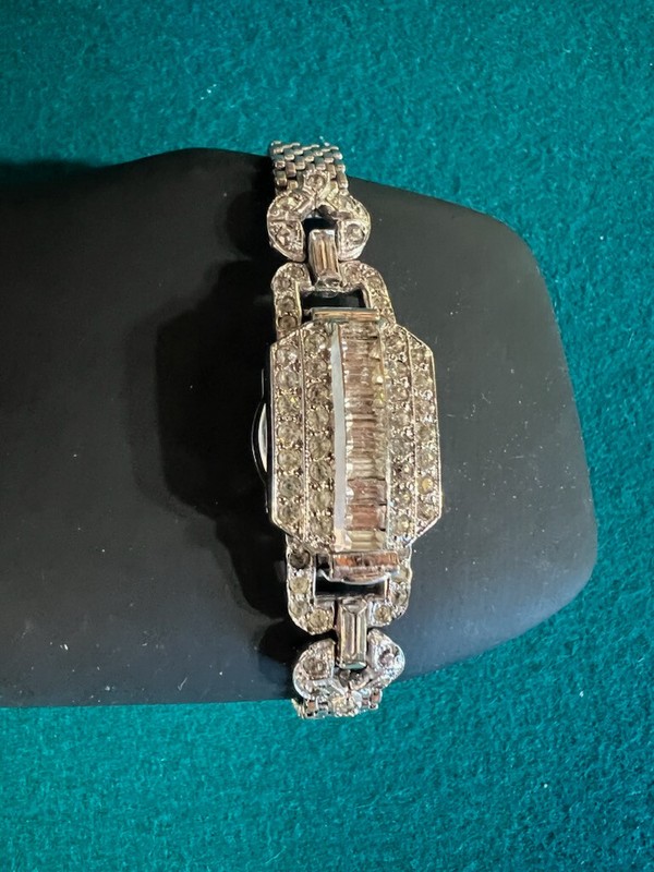 Lady's Amito wristwatch absolutely Beautiful silvertone and covered with stones.