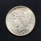 1928 Peace Dollar 1.00. Whiped. Net AU.