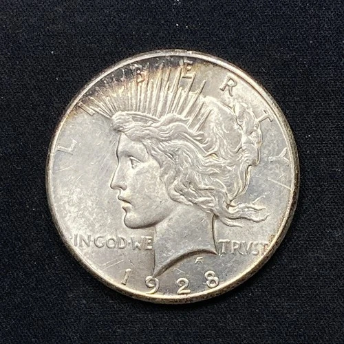 1928 Peace Dollar 1.00. Whiped. Net AU.